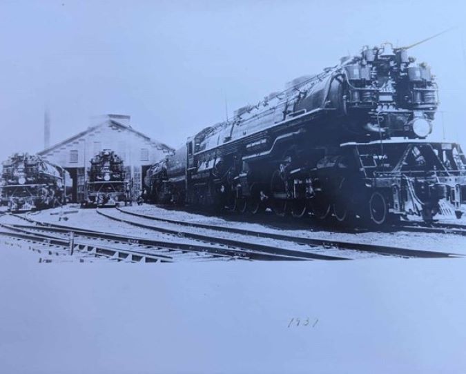A Great Northern steam locomotive at the Hillyard shop, 1937. The photo was taken at what is now the current location of the Parkwater mechanical engineering building at BNSF Yardley. 